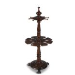 AN EARLY VICTORIAN MAHOGANY SNOOKER CUE STAND, of circular form with turned finial above eight