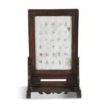 A CHINESE HARDWOOD TABLE SCREEN, Qing dynasty, inset with painted marble panel with figures in a