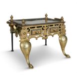 A GOTHIC-REVIVAL BRASS TRIVET STAND, 19th Century of rectangular shape with four pointed corner