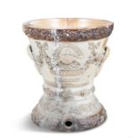 A VICTORIAN SALT GLAZED POTTERY CISTERN, of circular form, with moulded foliate decoration water