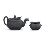 A WEDGWOOD BLACK BASALT WARE DUKE OF WELLINGTON COMMEMORATIVE TEAPOT AND SUGAR BOWL, c.1815.