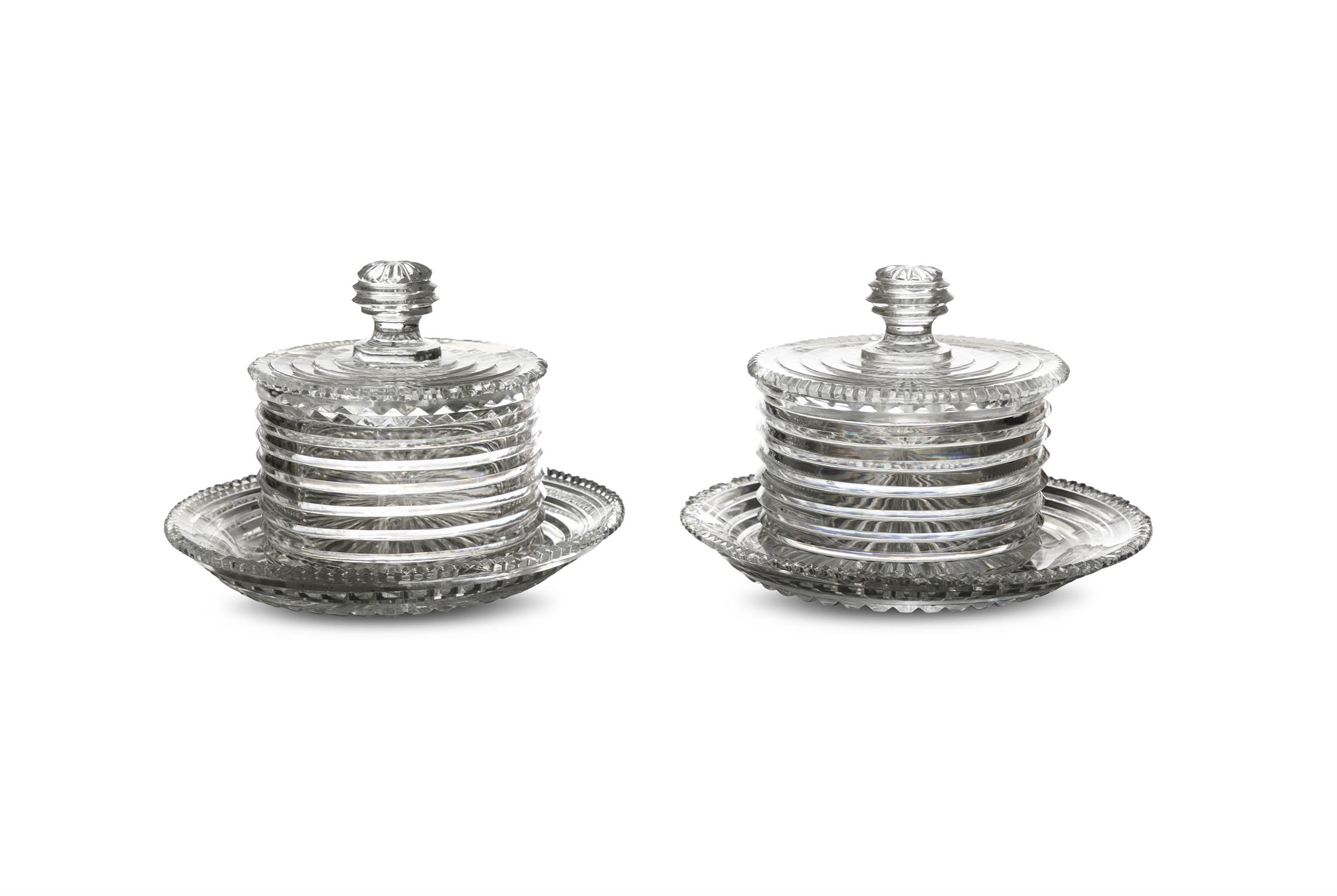 A FINE PAIR OF IRISH REGENCY CUTGLASS BUTTER POTS AND COVERS, with stands c.1800,