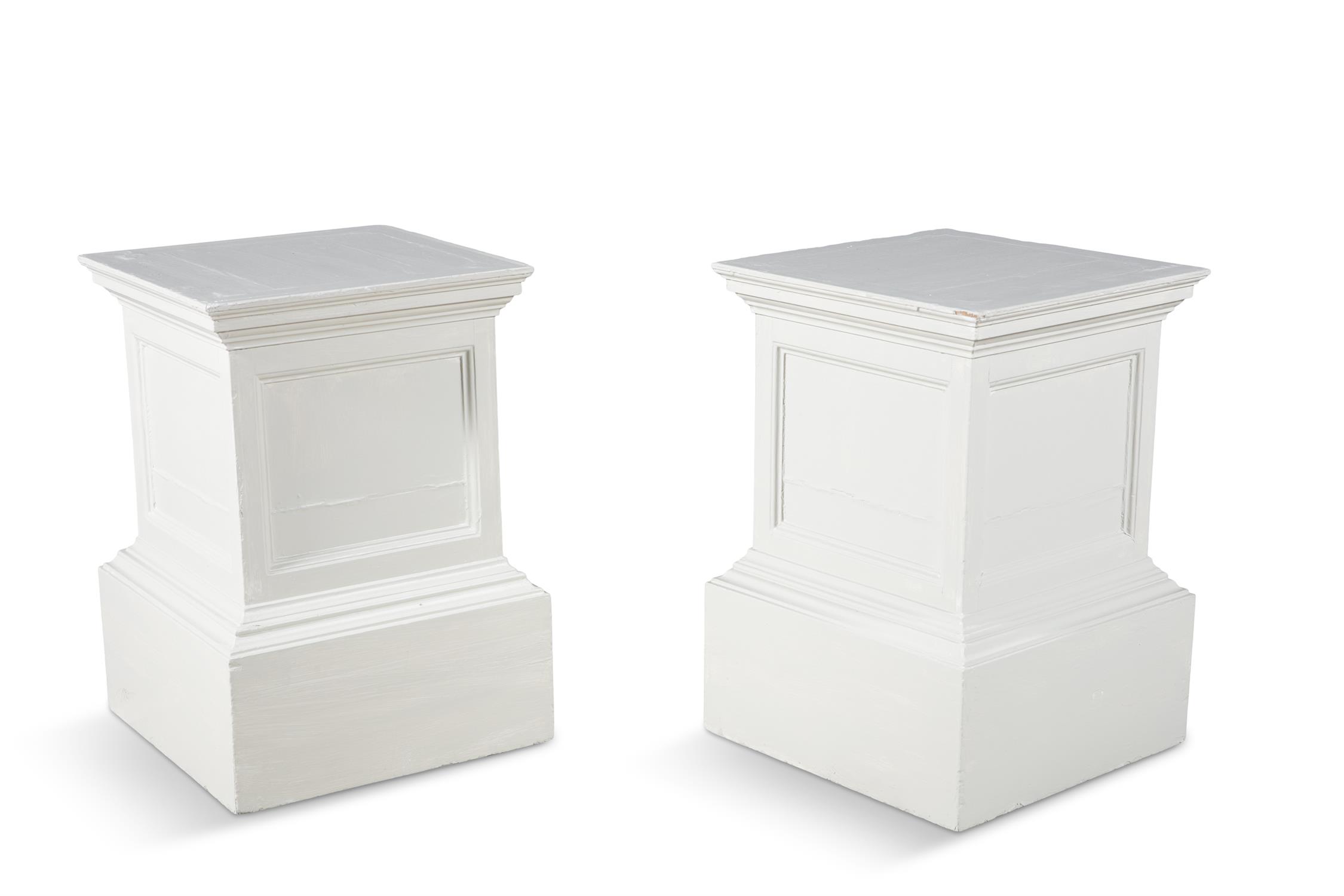 A PAIR OF WHITE PAINTED TIMBER PLINTHS, of squared form, each side with recessed fielded panels.