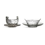 A CUT GLASS BUTTER BOAT ON STAND, of oval form, with raised fan shaped handles and flat cut