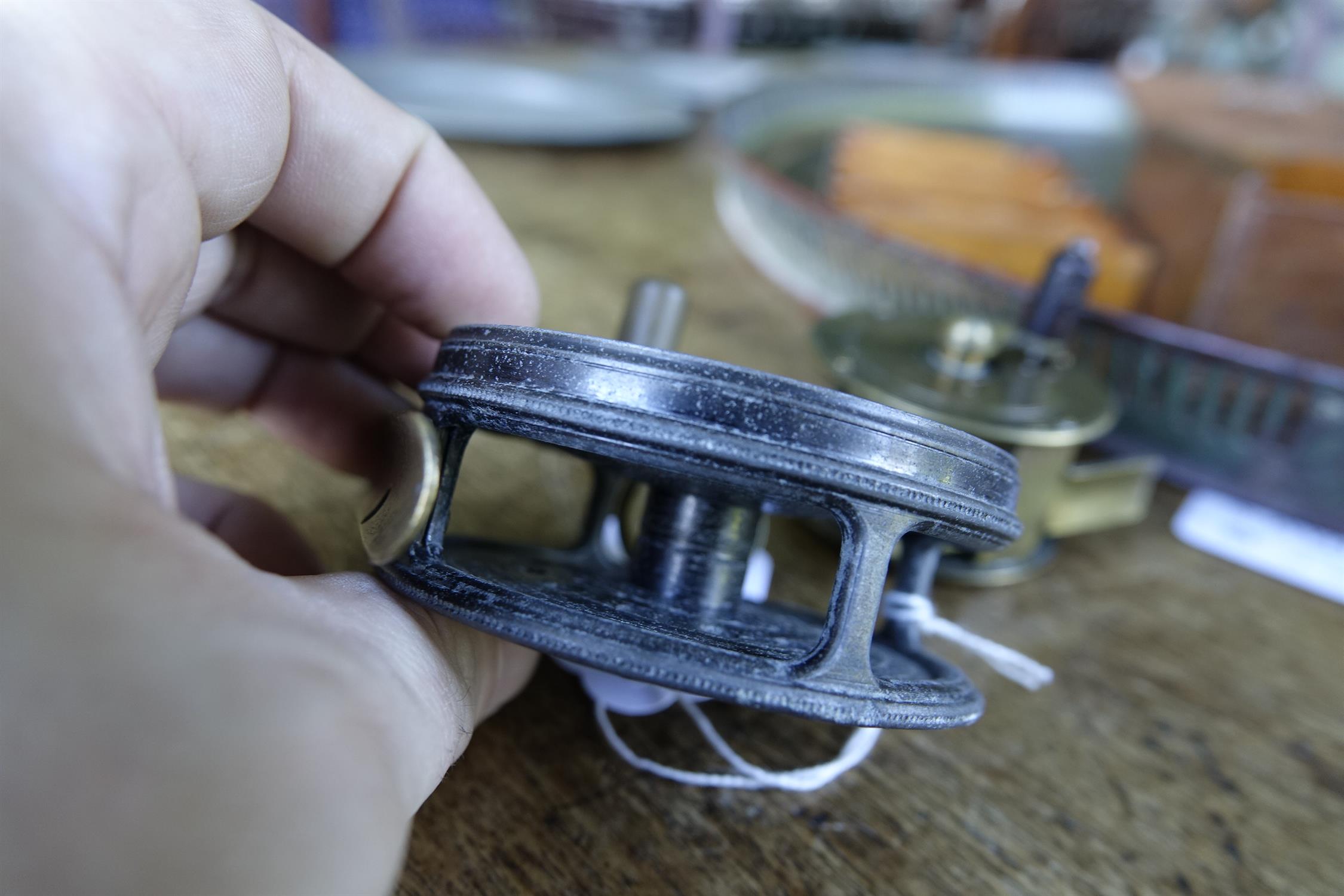 A COLLECTION OF FISHING AND ANGLING RELATED ITEMS, comprising: a Hardy 'Perfect Fly Reel' size - Image 11 of 20