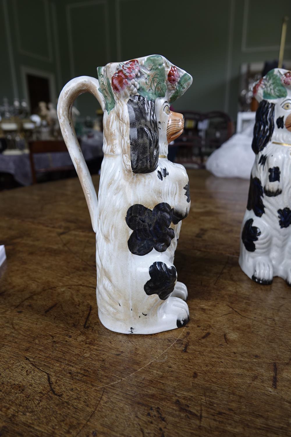 A PAIR OF 19TH CENTURY STAFFORDSHIRE JUGS, moulded in the form of spaniels. 26cm high; Together - Image 11 of 16