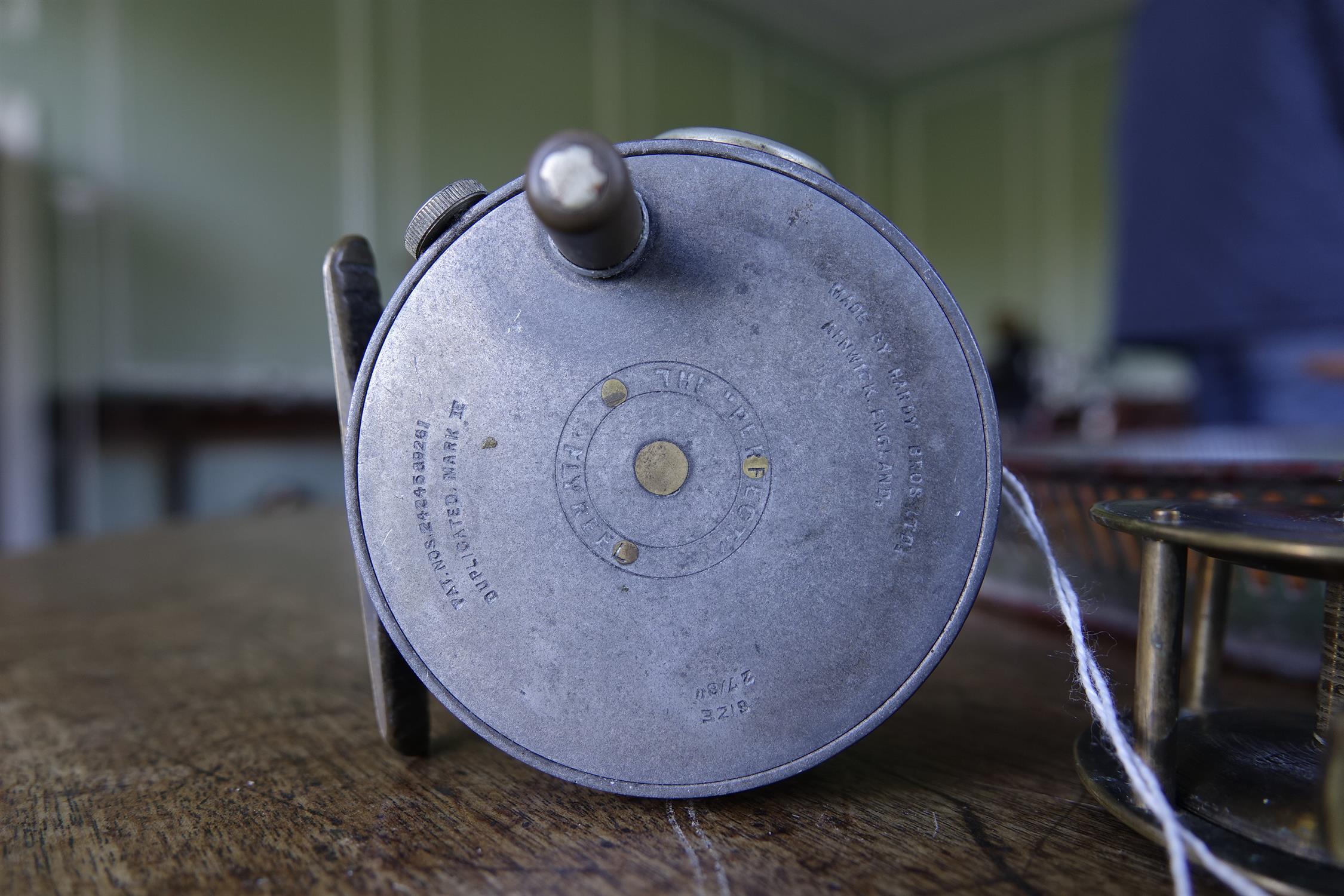 A COLLECTION OF FISHING AND ANGLING RELATED ITEMS, comprising: a Hardy 'Perfect Fly Reel' size - Image 6 of 20