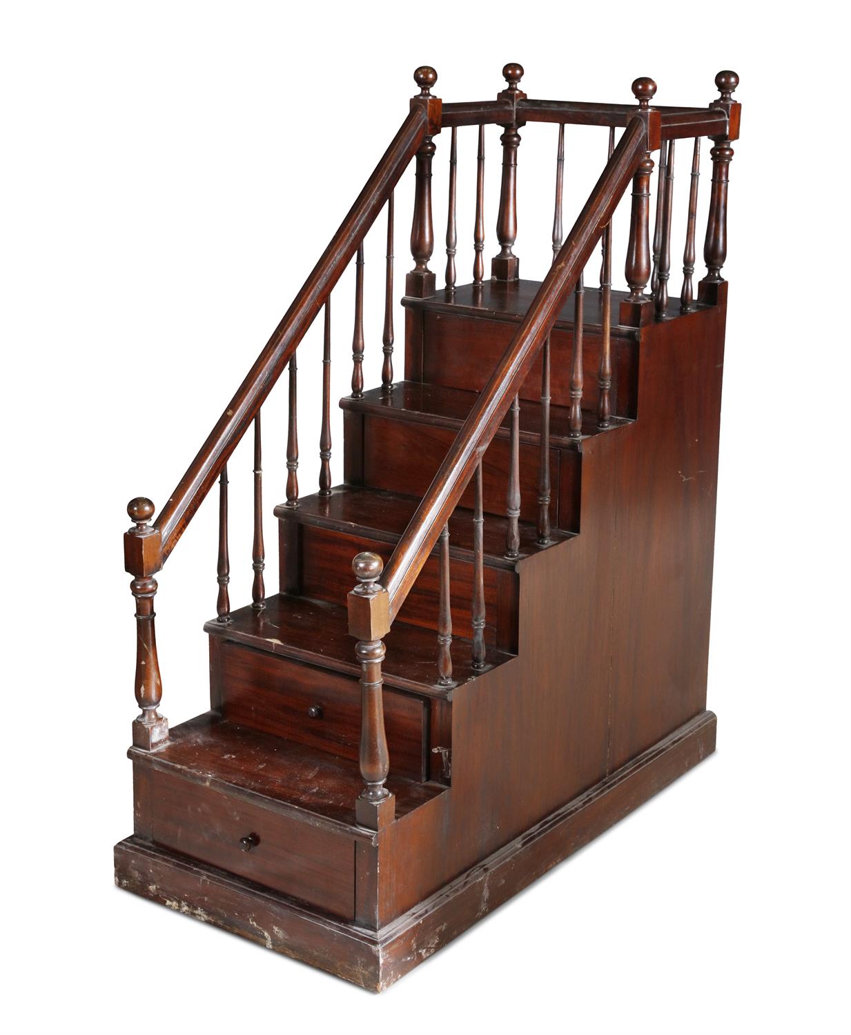 A 19TH CENTURY MAHOGANY LIBRARY STEPS, enclosed within spindle turned supports, the base with