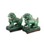 A PAIR OF SANCAI GLAZED BUDDHIST TEMPLE LIONS, 19th century, each supported on rectangular hardwood