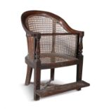 A WILLIAM IV MAHOGANY FRAMED TUB BACK CHILD'S CHAIR, with arched caned back and sides,