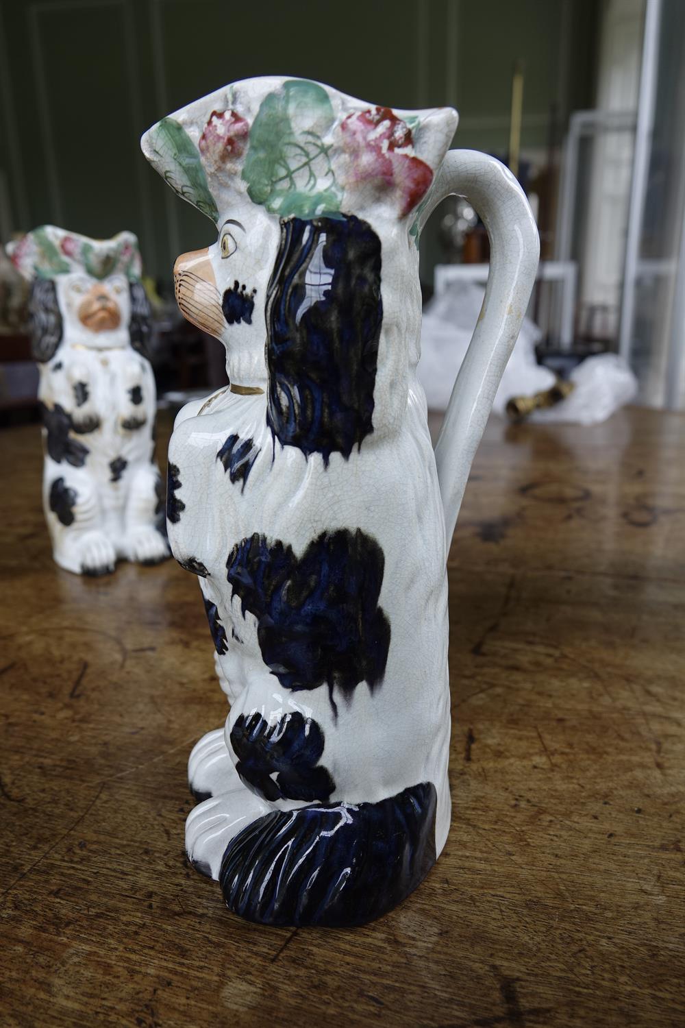 A PAIR OF 19TH CENTURY STAFFORDSHIRE JUGS, moulded in the form of spaniels. 26cm high; Together - Image 3 of 16