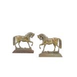 A PAIR OF CAST BRASS DOOR STOPS, in the form of prancing horses. 24cm high