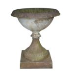 A LARGE VICTORIAN CAST IRON GARDEN URN, with everted circular rim, the body cast with upright