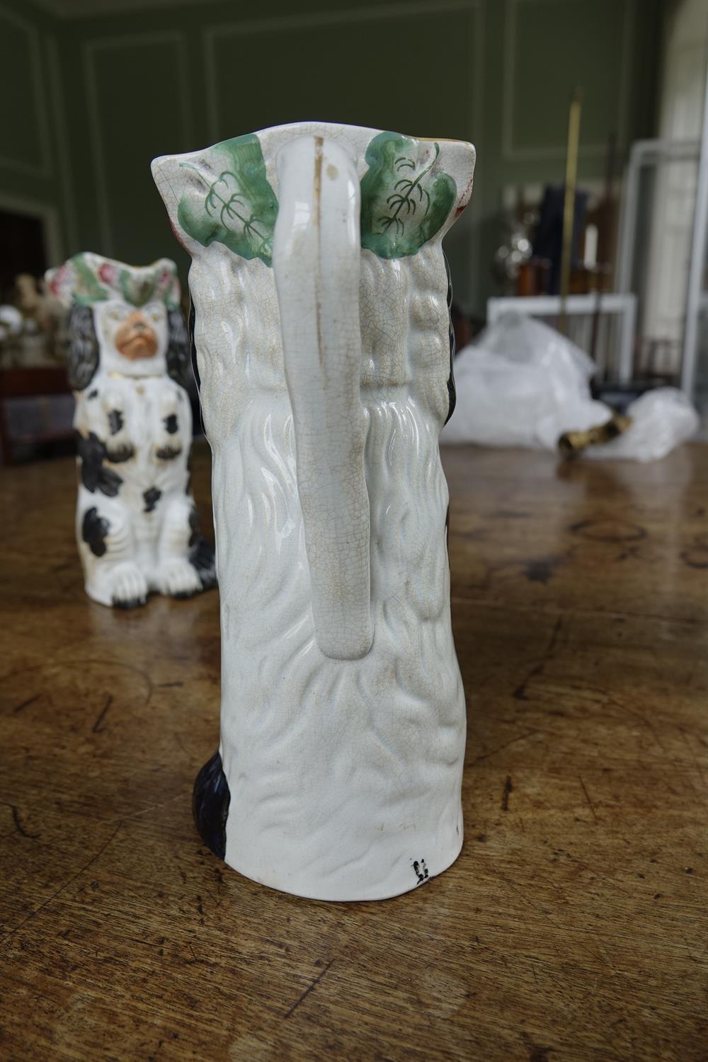 A PAIR OF 19TH CENTURY STAFFORDSHIRE JUGS, moulded in the form of spaniels. 26cm high; Together - Image 4 of 16