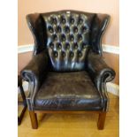 ***ADDITIONAL LOT*** A GEORGE III STYLE MAHOGANY FRAMED WING BACK ARMCHAIR, upholstered in