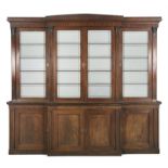 A 19TH CENTURY MAHOGANY RECTANGULAR BREAKFRONT BOOKCASE, with moulded cornice above four opaque