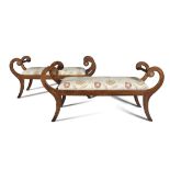 A PAIR OF IRISH REGENCY MAHOGANY FRAMED WINDOW SEATS, with inscrolled arms, with twist turned