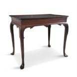 A GEORGE III IRISH MAHOGANY SILVER TABLE, with cavetto top with re-entrant corners and scroll