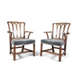 A PAIR OF GEORGE III PALE MAHOGANY FRAMED ARMCHAIRS IN THE GOTHIC TASTE, the pierced back having
