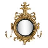 AN IRISH GEORGE IV CONVEX GIRANDOLE MIRROR BY CORNELIUS O'CALLAGHAN, DUBLIN, surmounted by a putto