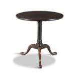 A GEORGE III MAHOGANY CIRCULAR TRIPOD TABLE, on turned centre pillar and tripod base. 70cm diameter