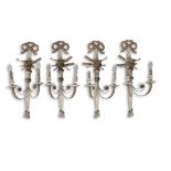 A SET OF FOUR REGENCY STYLE CREAM PAINTED AND GILT TWO-LIGHT WALL SCONCES, with tied ribbons,