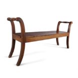 AN IRISH WILLIAM IV LONG MAHOGANY BENCH, by Williams and Gibton, with double scroll ends,