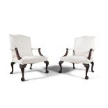 A PAIR OF MAHOGANY FRAMED UPHOLSTERED GAINSBOROUGH ARMCHAIRS, the shaped panel backs,