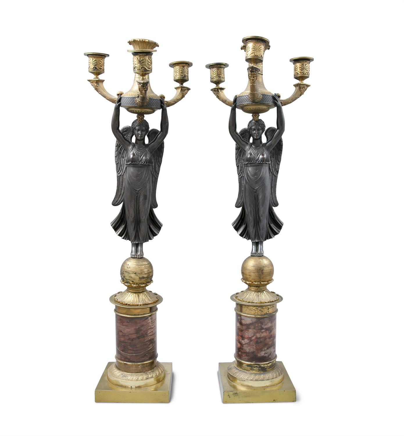 A PAIR OF FRENCH EMPIRE ORMOLU AND MARBLE FIGURAL CANDELABRA, modelled with a winged victory