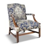 A GEORGE III MAHOGANY FRAMED UPHOLSTERED GAINSBOROUGH ARMCHAIR, in the Chippendale taste,