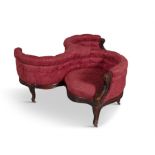 A VICTORIAN MAHOGANY FRAMED UPHOLSTERED TRIPLE TUB BACK CONVERSATION SEAT, covered in buttoned deep