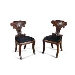 A PAIR OF MAHOGANY REGENCY NEO-GRECIAN HALL CHAIRS, with bowed tablet cresting, and conjoined