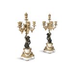 A PAIR OF 19TH CENTURY ORMOLU AND BRONZE FIGURAL CANDELABRA, the four candle sconce branches