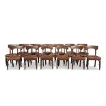 A SET OF EIGHTEEN WILLIAM IV MAHOGANY DINING CHAIRS, each with tablet backs, above padded seats