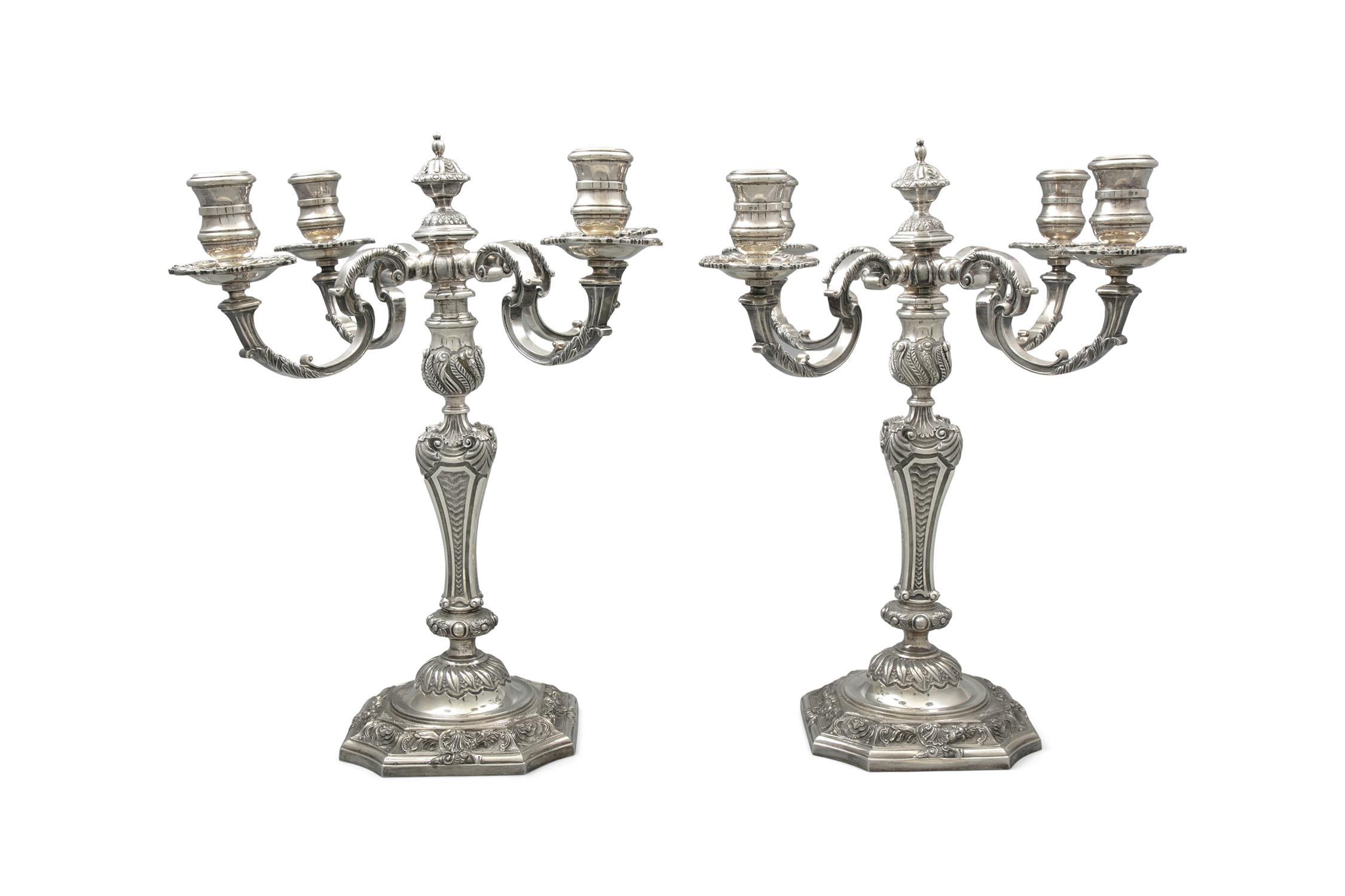 AN IMPORTANT PAIR OF SILVER FOUR-LIGHT CANDELABRA, London 1957, modelled in Louis XVI style,