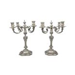 AN IMPORTANT PAIR OF SILVER FOUR-LIGHT CANDELABRA, London 1957, modelled in Louis XVI style,