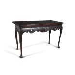 AN IRISH CARVED MAHOGANY CONSOLE TABLE, MID-18TH CENTURY, the deep frieze centred by a shell and