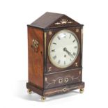 A REGENCY MAHOGANY AND BRASS INLAID ARCHITECTURAL BRACKET CLOCK, applied with twin lined side