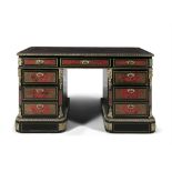 A 19TH CENTURY FRENCH BOULLE WORK KNEEHOLE DESK, the rectangular top inset with a tooled red