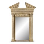 A GEORGE III STYLE CARVED GILTWOOD MIRROR, in the manner of William Kent, the open triangular