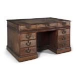 A FINE GEORGE III MAHOGANY PEDESTAL DESK AFTER A DESIGN BY THOMAS CHIPPENDALE, the rectangular top