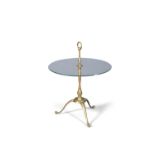 SIDE TABLE A circular glass topped side table, on a brass tripod base, Italy c.1960.