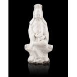 A DEHUA / BLANC DE CHINE MOLDED PORCELAIN MODEL OF GUANYIN WITH A CHILD China, Qing Dynasty,