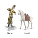 A SLIP DECORATED TERRACOTTA MODEL OF A HORSE China, Tang Dynasty The horse naturalistically
