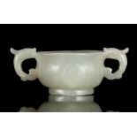 A WHITE JADE ‘LISHUI WAVES AND MOUNTAIN PEAK’ TWO-HANDLED CUP China, Ming Dynasty,