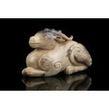 A LARGE CHICKEN BONE JADE CARVING OF A RECUMBENT DEER China, Possibly Ming Dynasty Carved as a