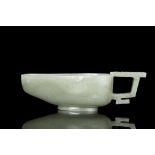A LARGE PALE CELADON JADE ONE-HANDLED LIBATION CUP, YI China, Ming Dynasty, 16th-17th century The