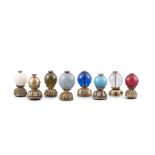 A COLLECTION OF EIGHT (8) MANDARIN HAT FINIALS China, Qing Dynasty Including one cleat glass