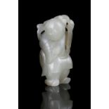 A JADE CARVING OF A BOY WITH A LOTUS SPRIG China, Qing Dynasty, 19th century The boy is holding