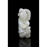 A JADE CARVING OF A BOY WITH A LINGZHI SPRIG China, Qing Dynasty, 19th century The boy is holding